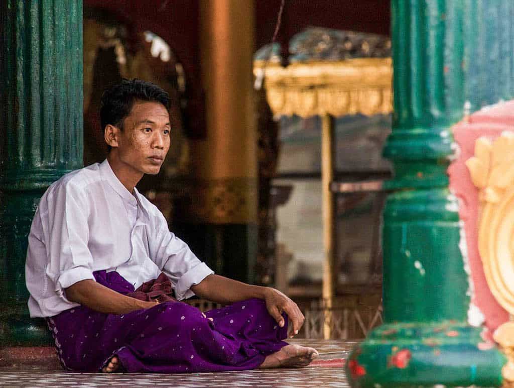 a man in Shwedagon pagoda in yangon myanmar