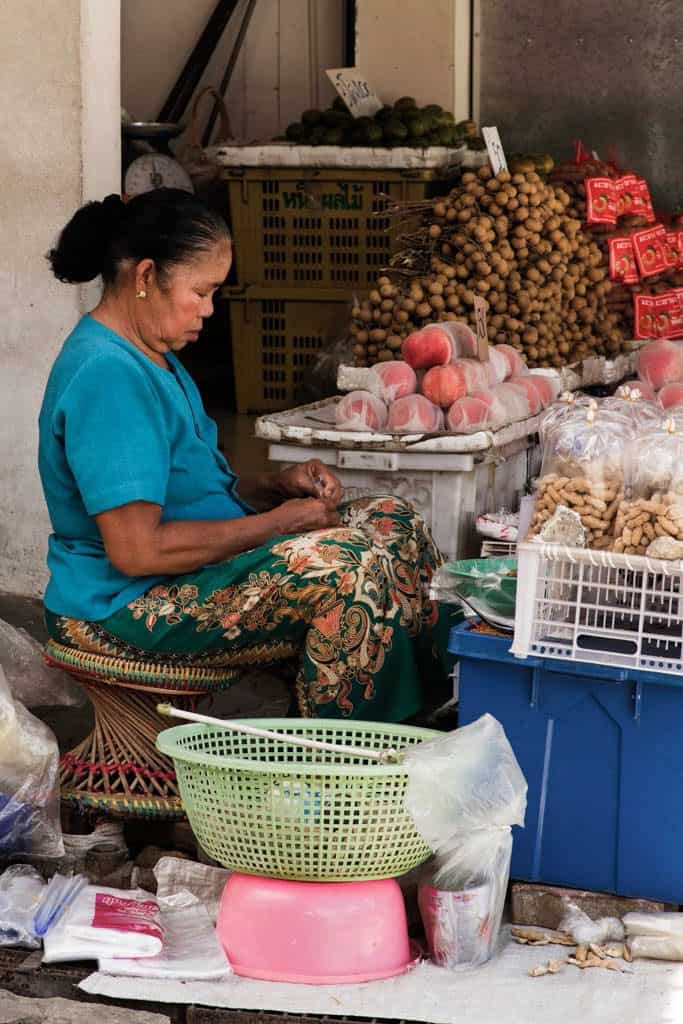 woman selling fruits and peanuts Northern Thailand