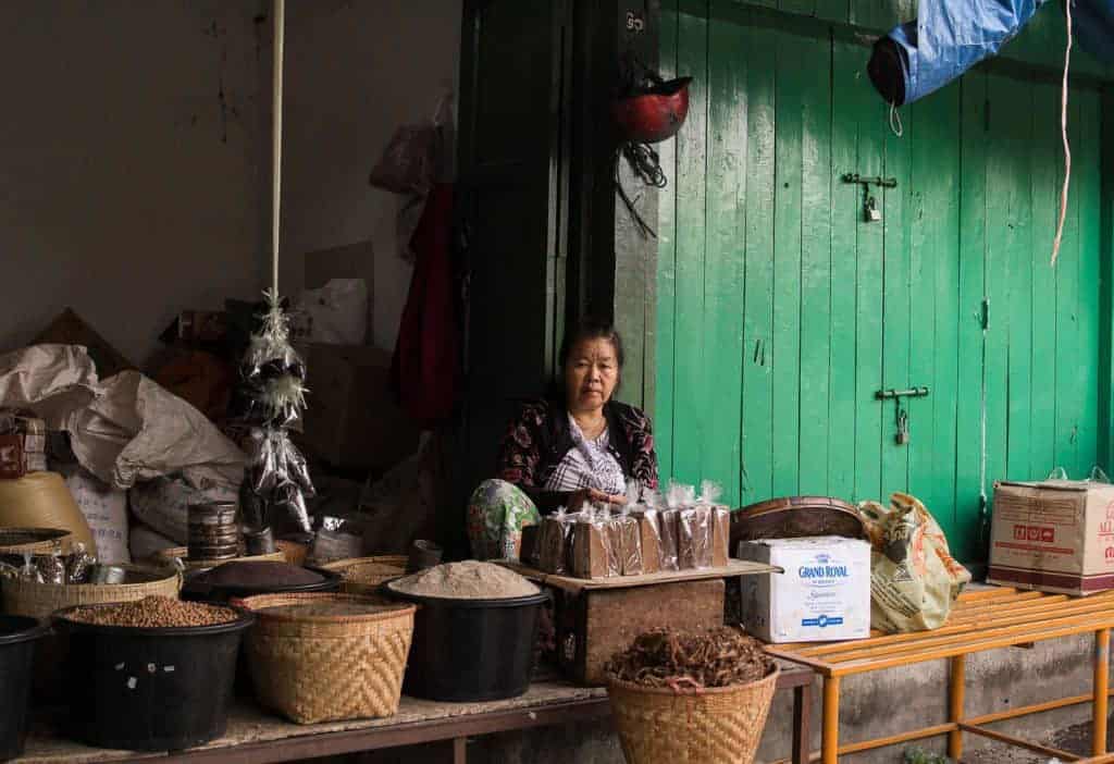 A Burmese woman selling things in the market