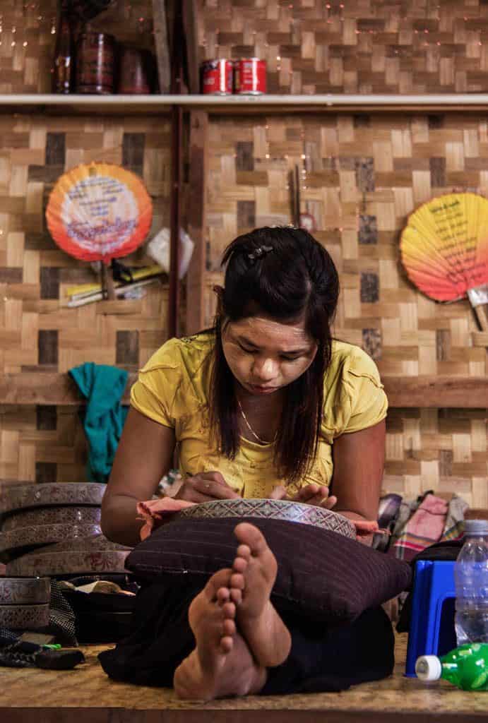 a woman working n Bagan lacquerware factory myanmar burma