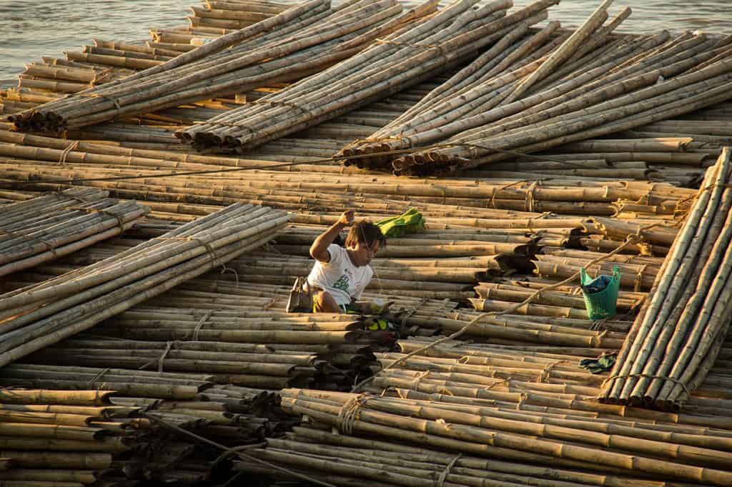 a man weaving bamboo