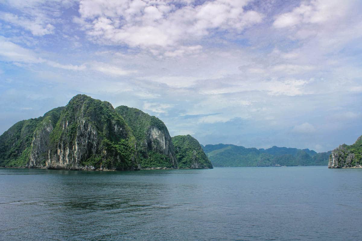 Cliff with green vegetation in Halong Bay