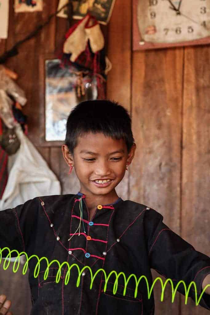 A local Burmese child playing with a plastic toy