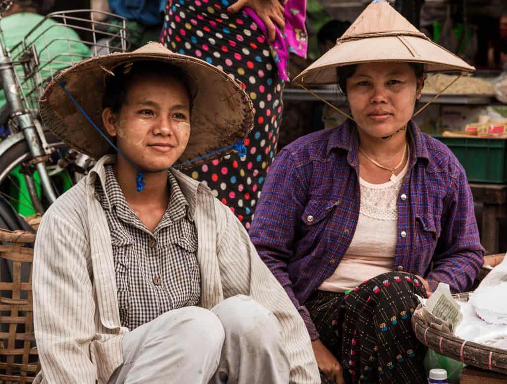 Two women with straw hats Myanmar