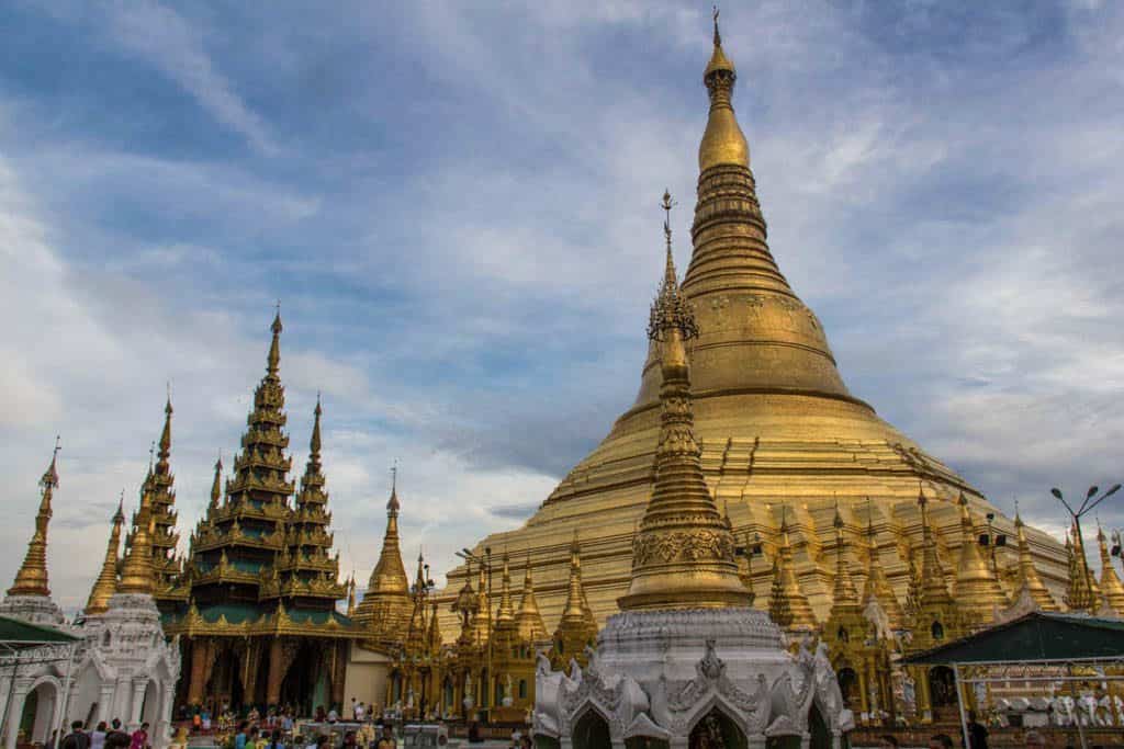 huge golden pagoda surrounded by small ones