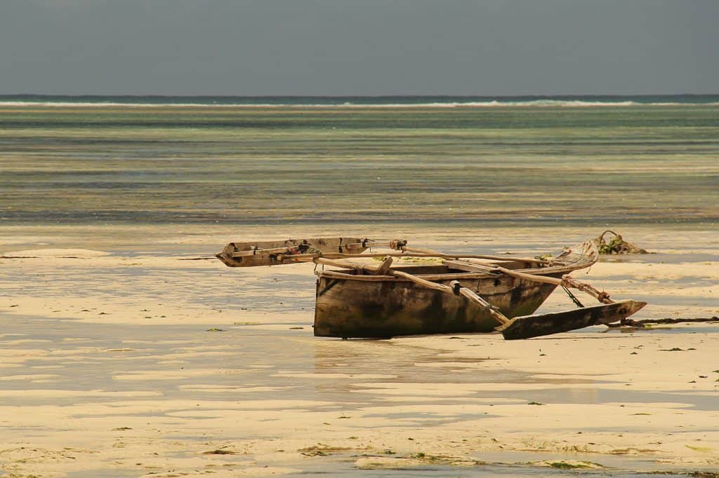 wooden dhow boat on the beach