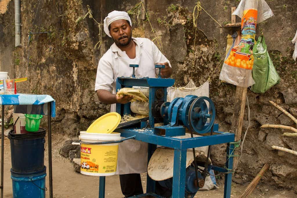 Man making sugar cane juice