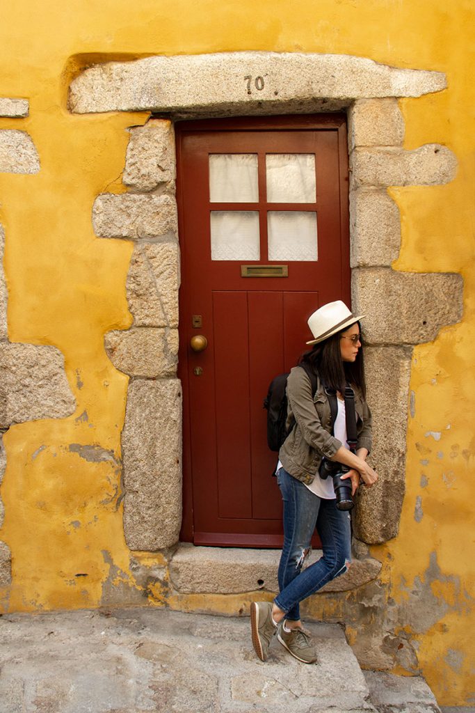 a girl in Porto's colorful alleys
