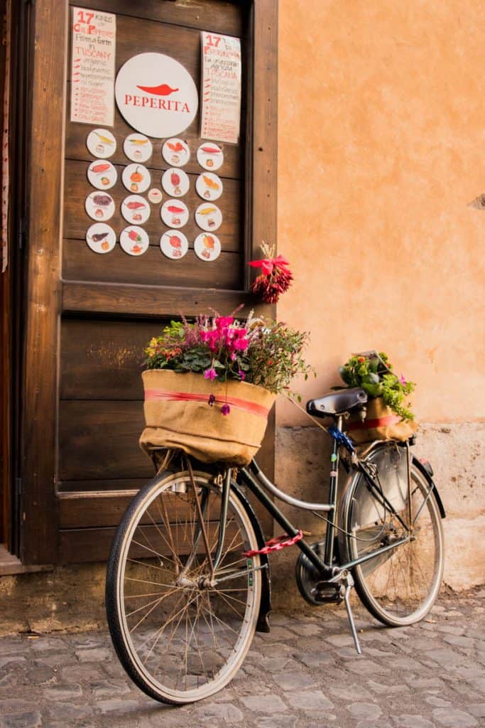 a bicycle leaning against a door