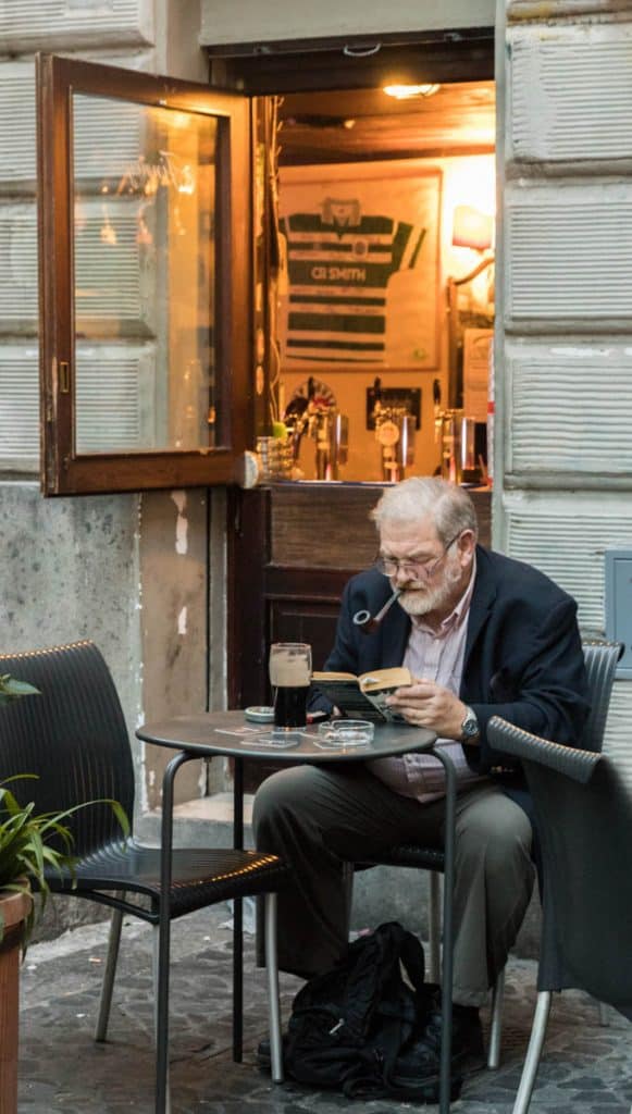 a man reading a book in one of Montie's cafes