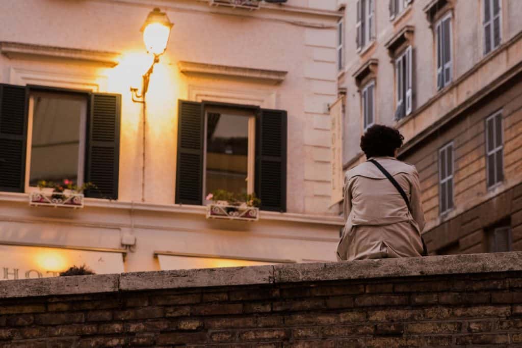 a woman sitting in one of Rome's hippest neighborhood