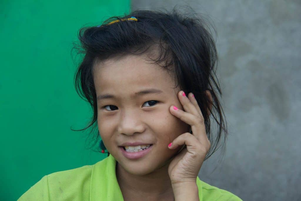 a smiling Burmese girl