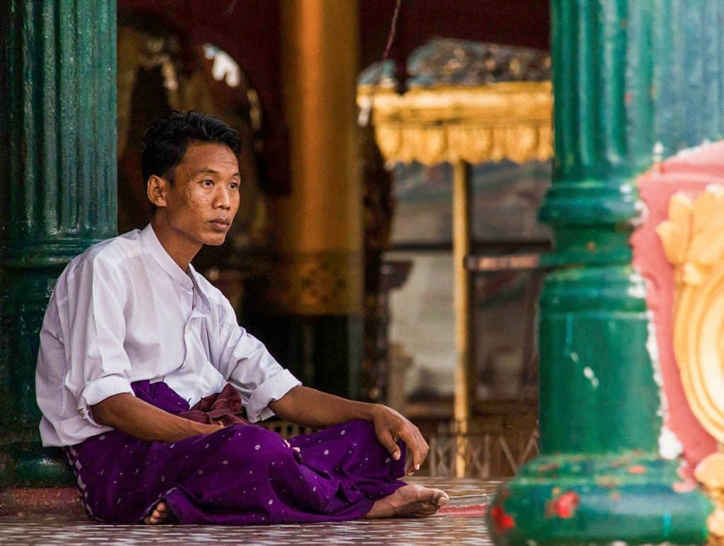 a praying man in Shwedagon pagoda