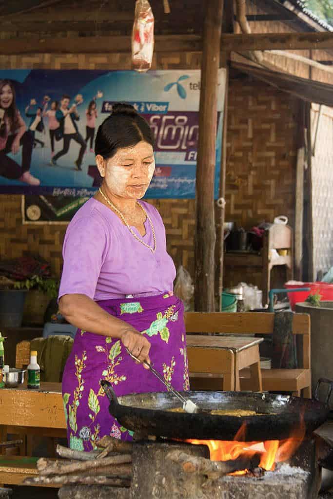 a woman selling street food in myanmar burma