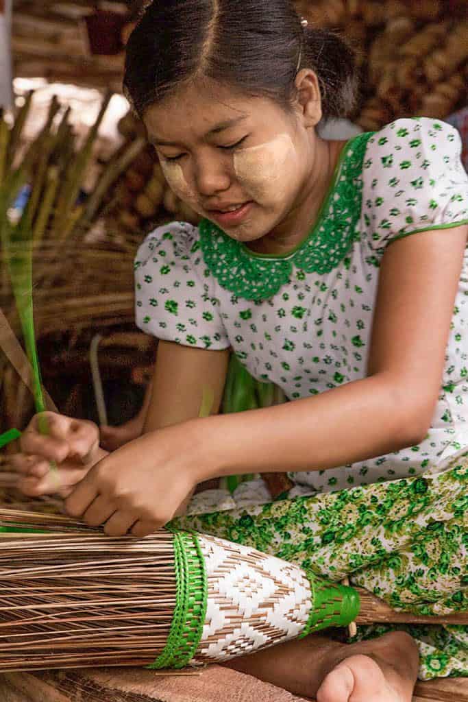 a woman making a broom in myanmar burma