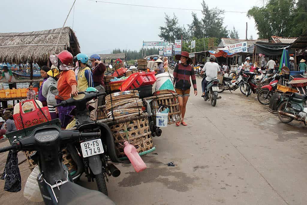 motorbikes awith straw baskets in a fishing village Vietnam