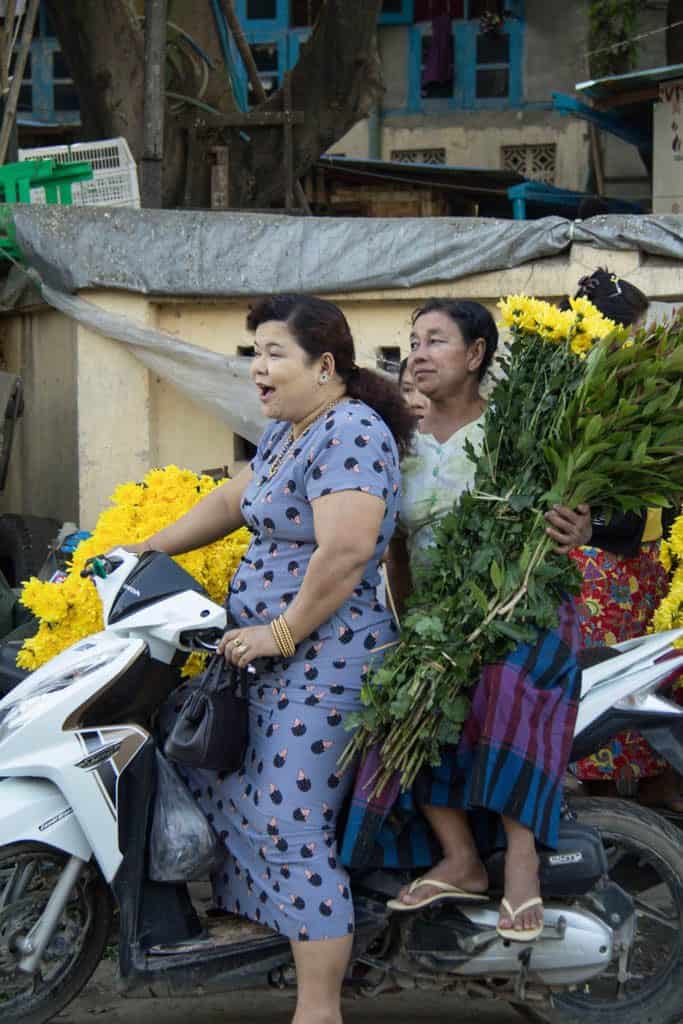 myanmar's locals riding on a bike in mandalay