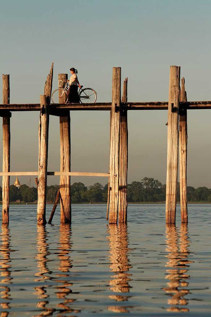 crossing u bein bridge in myanmar burma