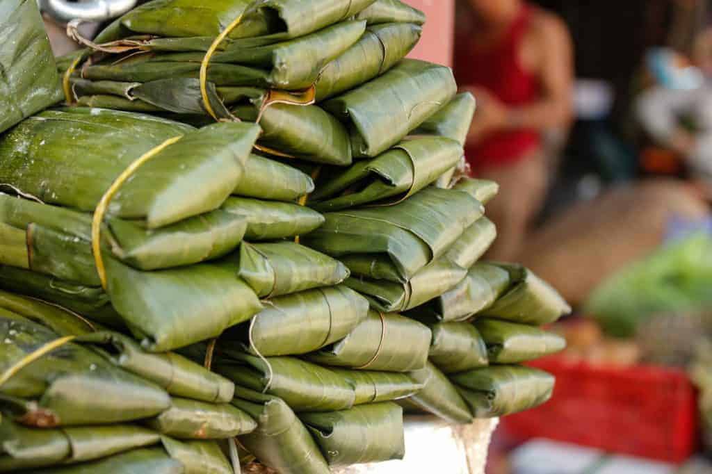 Piles of wrapped banana leaves