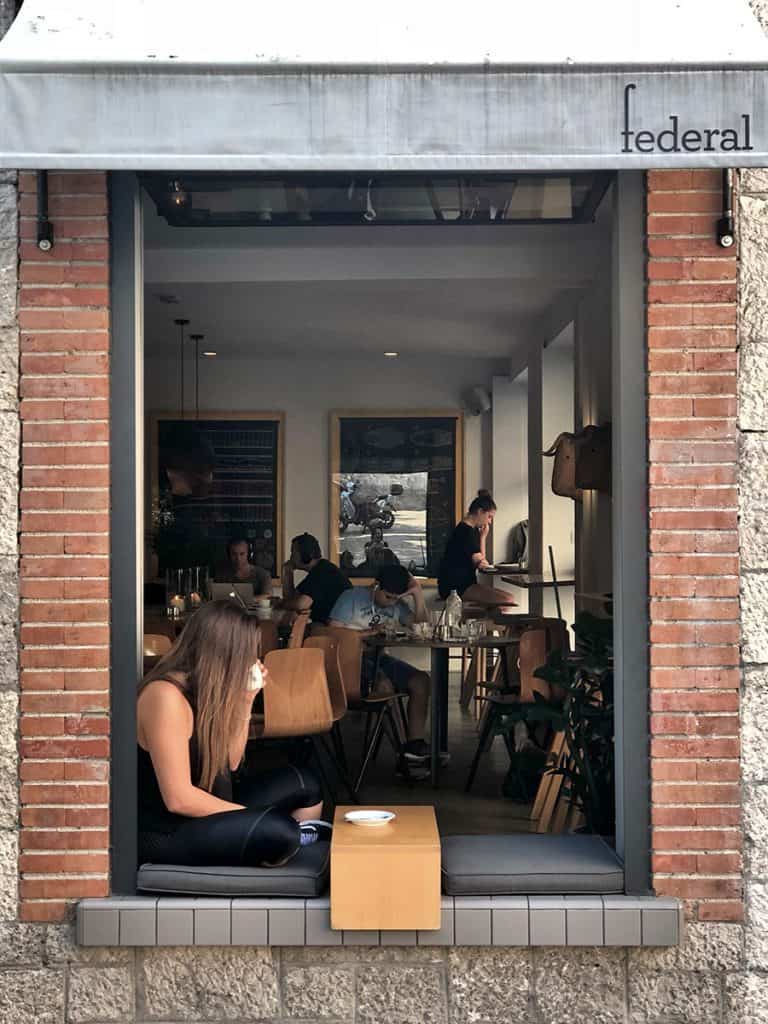 a girl drinking coffee in madrid