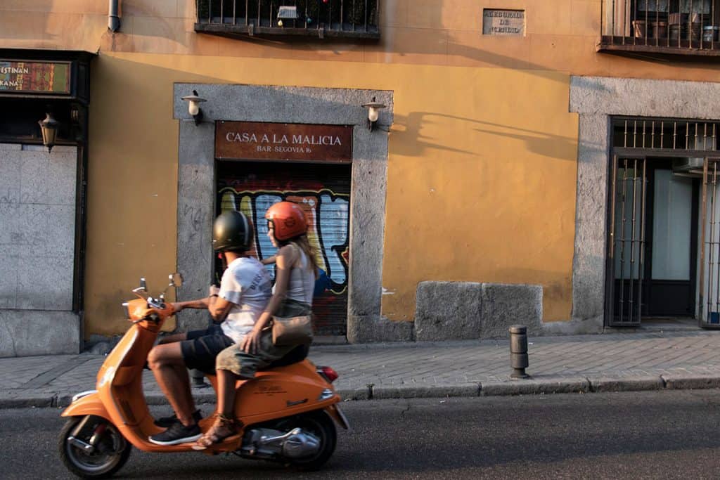 a couple riding on a motorcycle