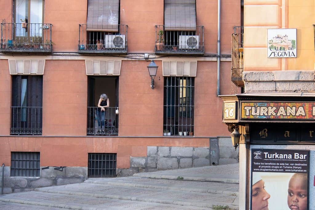 a woman on a balcony in madrid