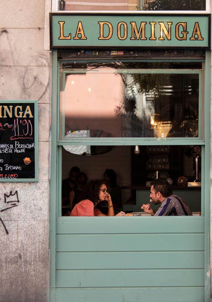 a couple sitting in a bar