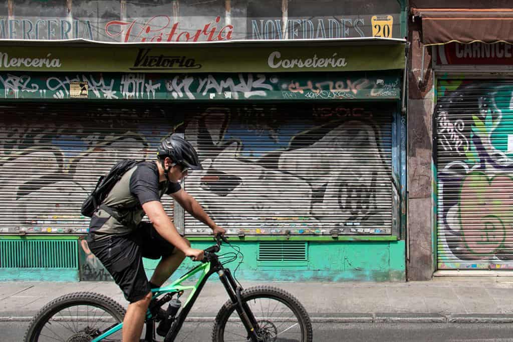 a man riding on his bicycle in madrid