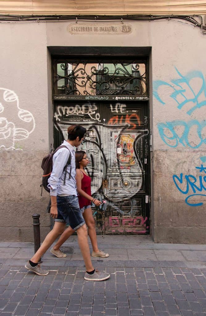 a couple walking in the streets of madrid