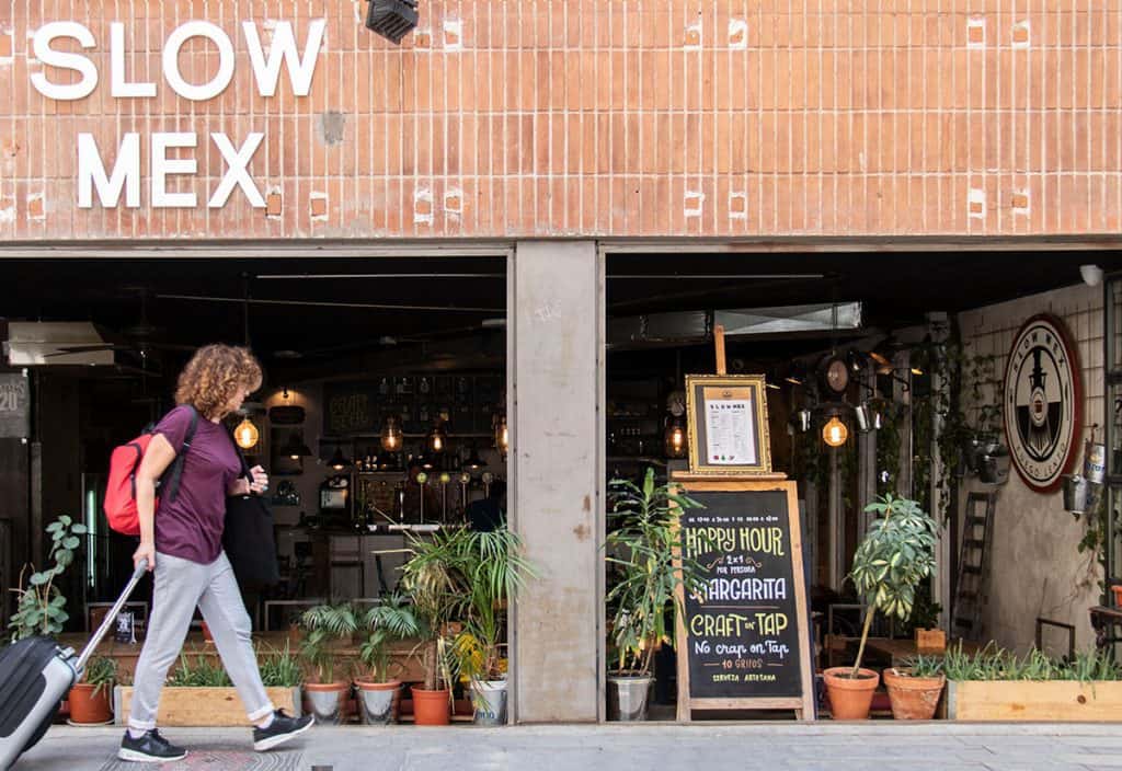 a women walking near a restaurant