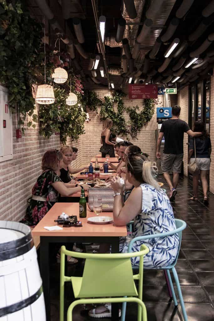 people eating in san anton market