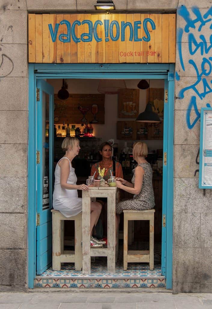 women drinking cocktails in a bar