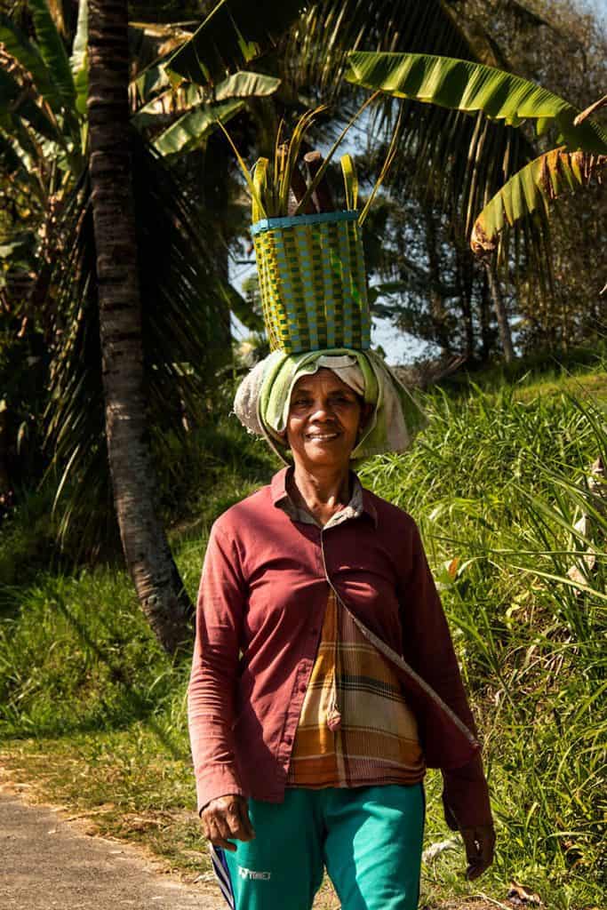 A woman carrying a basket in Munduk Bali