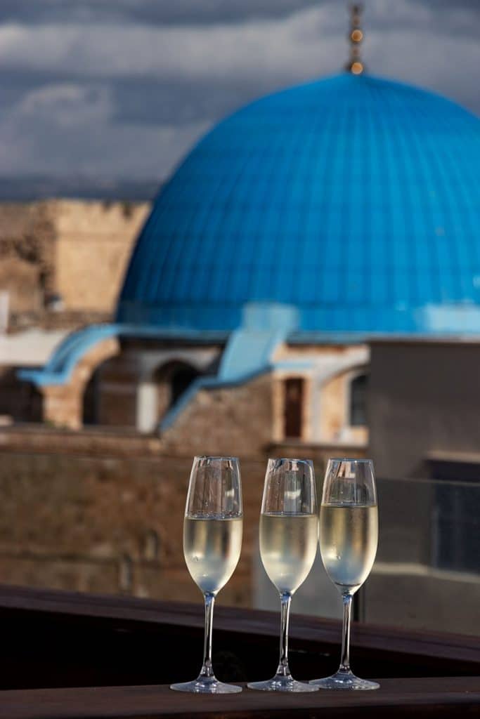 glasses with champagne and Akko's view in the background