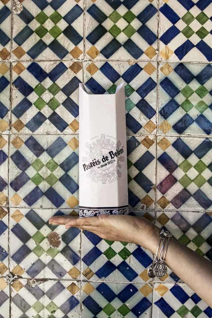 holding a box with the best pastel de nata in Lisbon