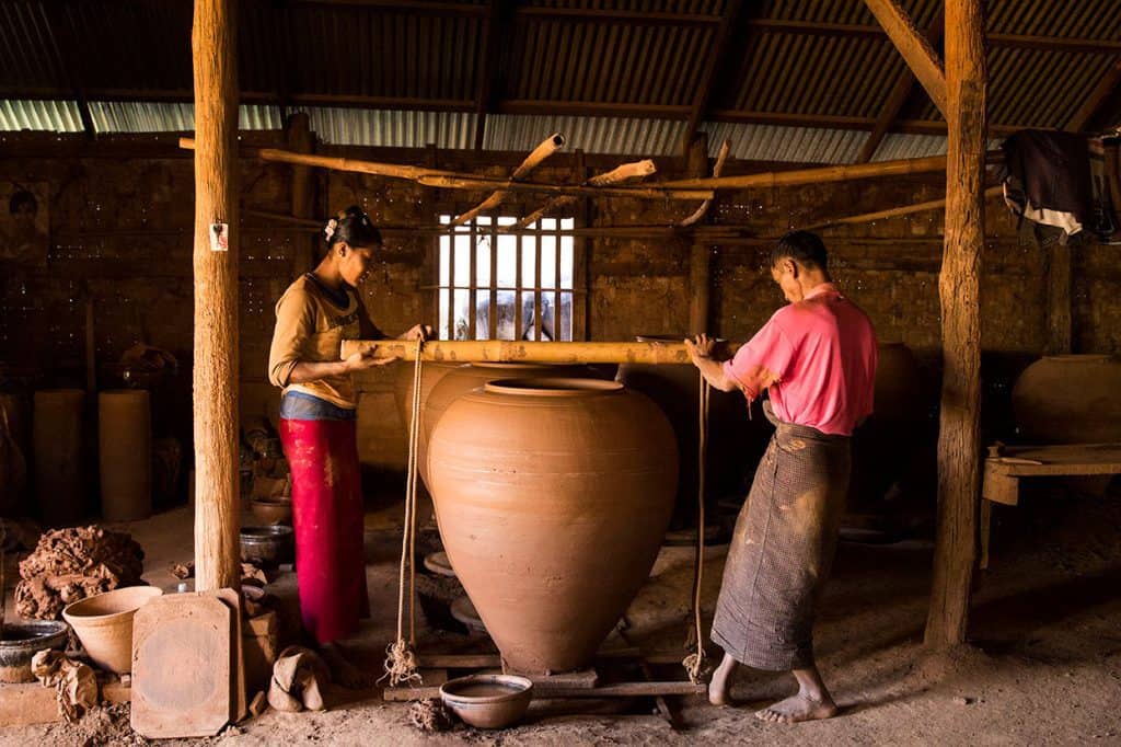 local Burmese people working in a terracotta pots factory in Myanmar