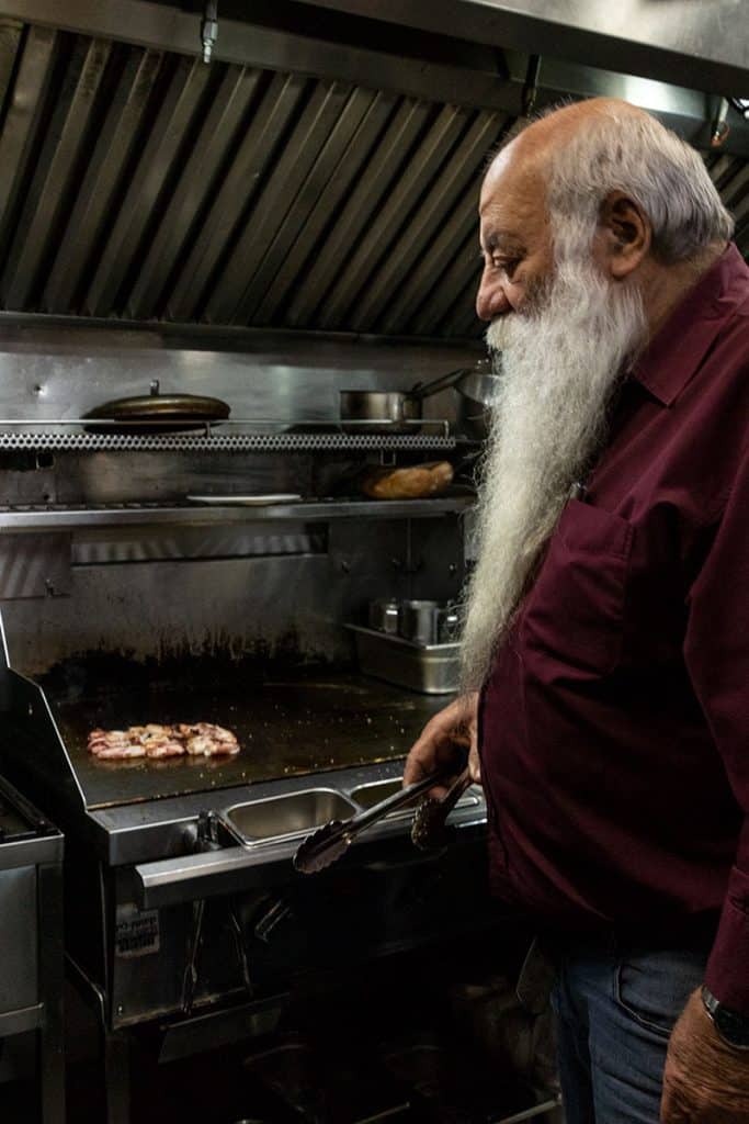 an Israeli chef grilling seafood