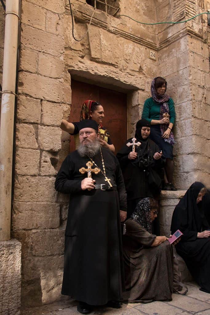 A group of praying people waiting for Easter procession in Jerusalem