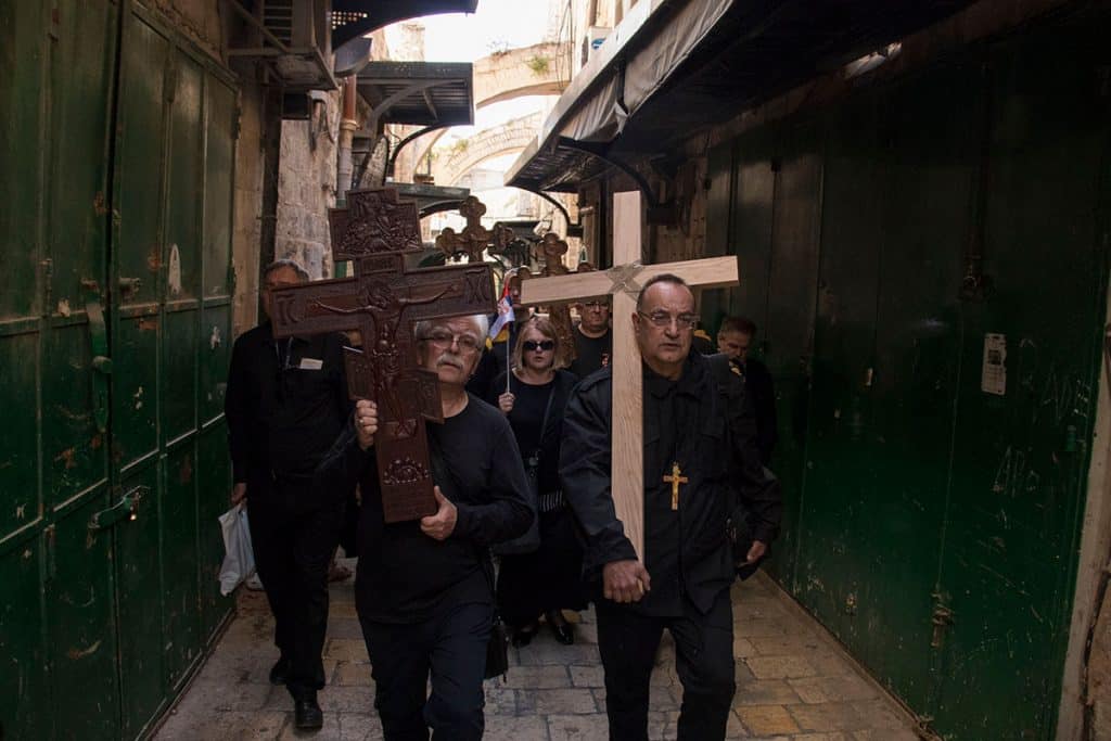 People carrying crosses in Jerusalem