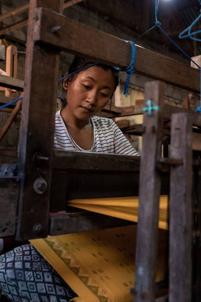 local girl in one of Bali's weaving factory in Sidemen