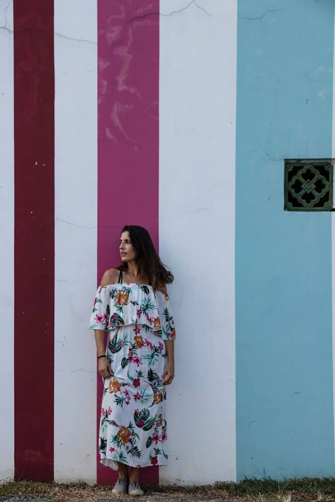 A girl standing in front of a graffiti in Singapore