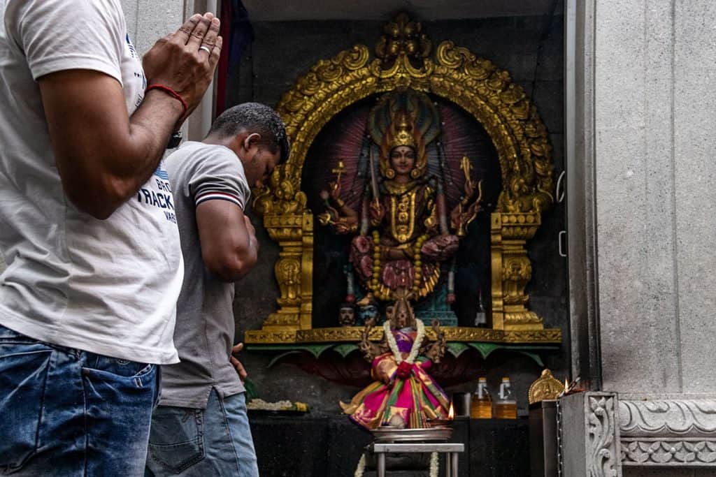 locals praying in Singapore