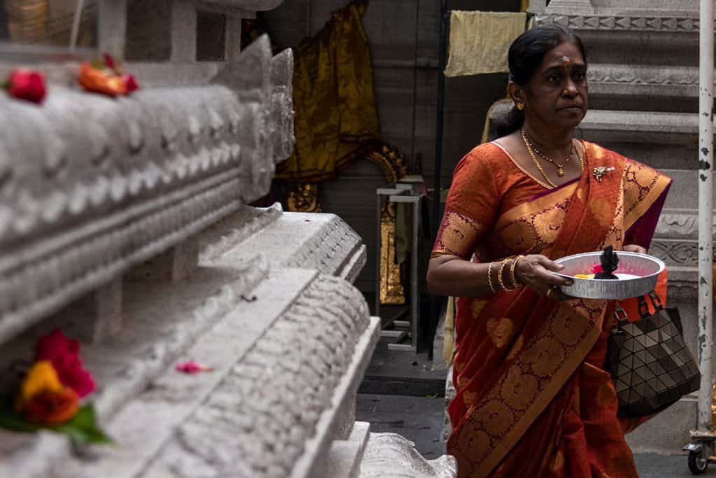 a women holding a candle in Singapore