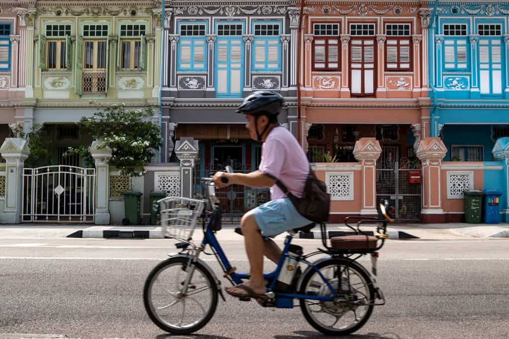 a man riding his bicycle in Joo Chiat neighborhood