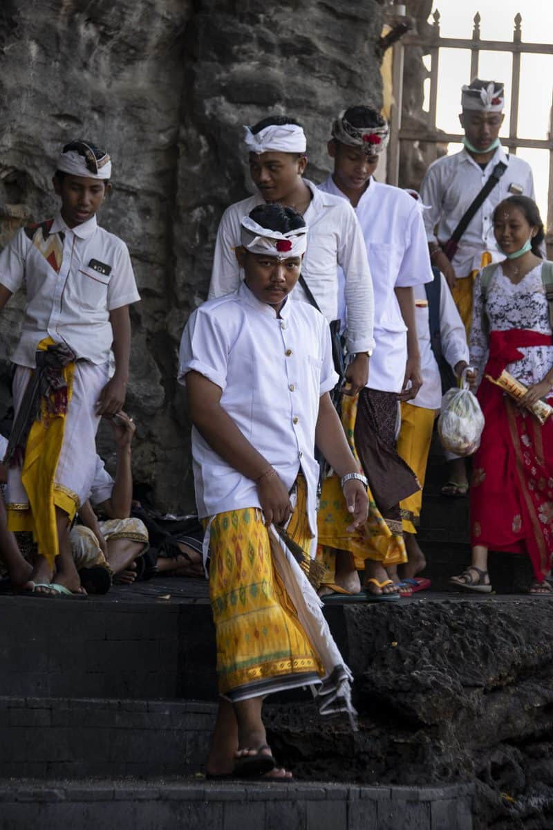 Balinese people leaving one of the temples in traditional outfits