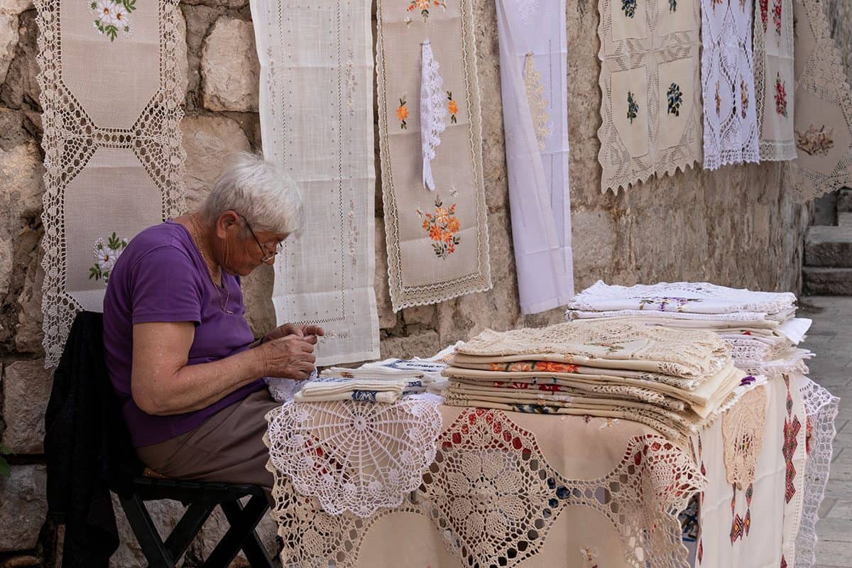 A woman selling souvenirs in Dubrovnik's Old Town