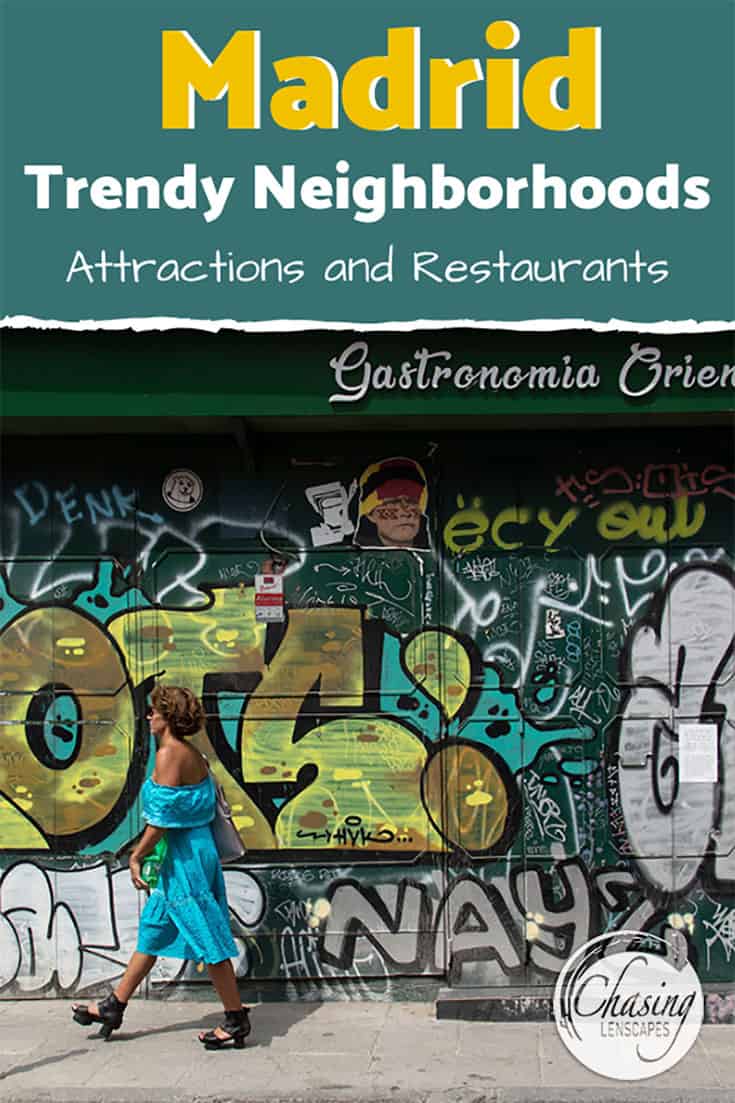 a woman walking in front of a colorful graffiti in madrid neighborhoods