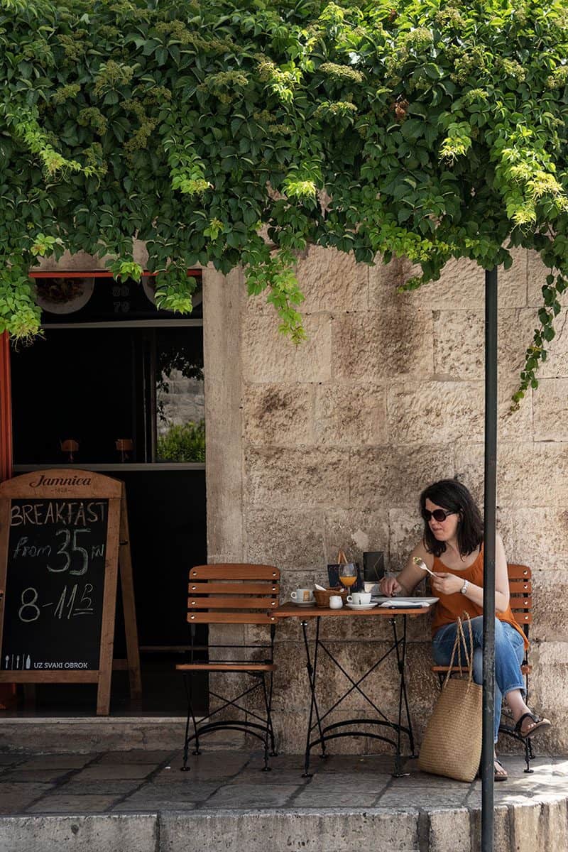 A woman eating lunch at one of Dubrovnik's restaurants