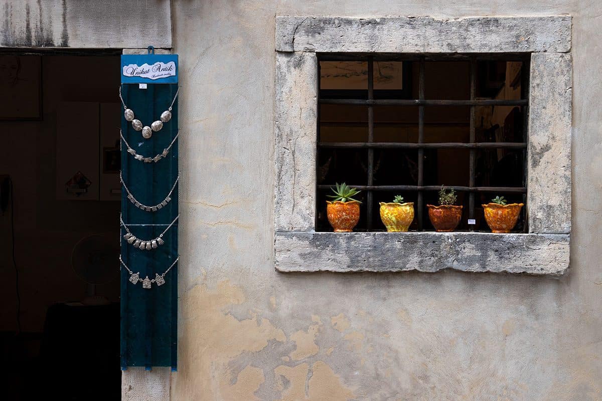 Necklaces and colorful pots in an Istrian artist village