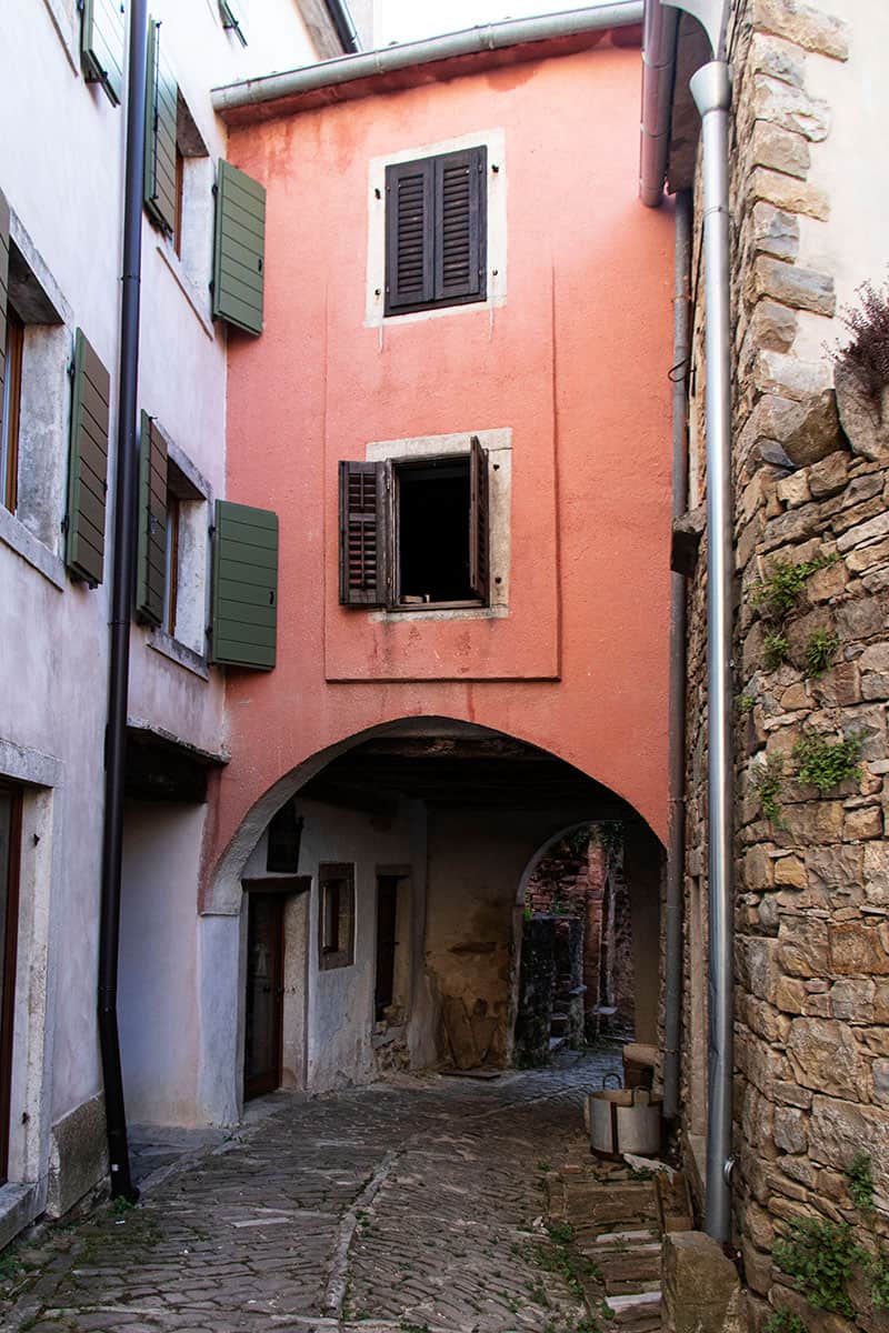 Pink wall in a cobbled street